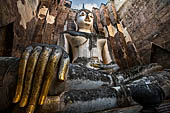 Thailand - Old Sukhothai - Wat Si Chum the roofless mondop enshrines the impressive 15 meter high seated Buddha named Phra Achana.  